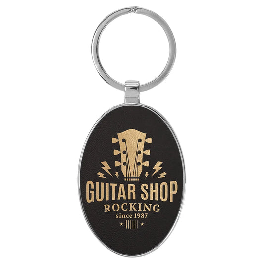 Black/Gold 3" x 1 3/4" Laserable Leatherette/Metal Oval Keychain