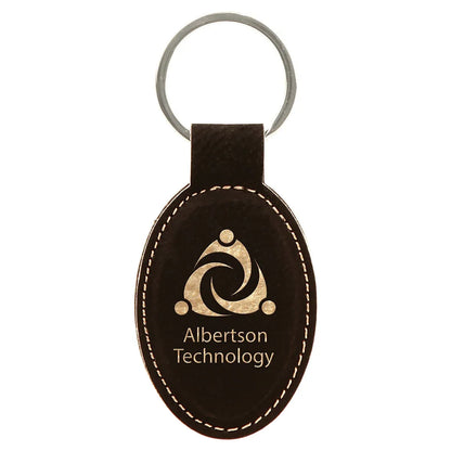 Black/Gold 3" x 1 3/4" Laserable Leatherette Oval Keychain