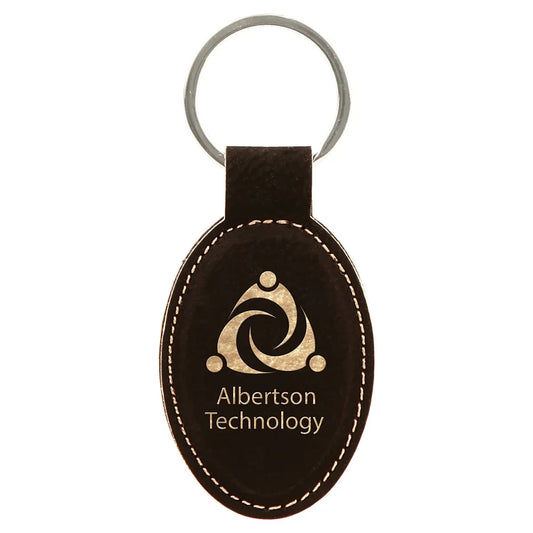Black/Gold 3" x 1 3/4" Laserable Leatherette Oval Keychain