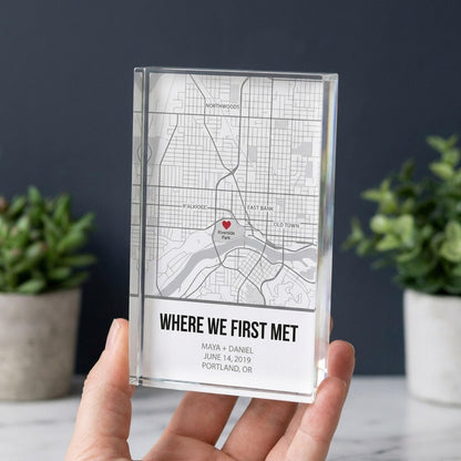 Hand holding a personalized location map acrylic block