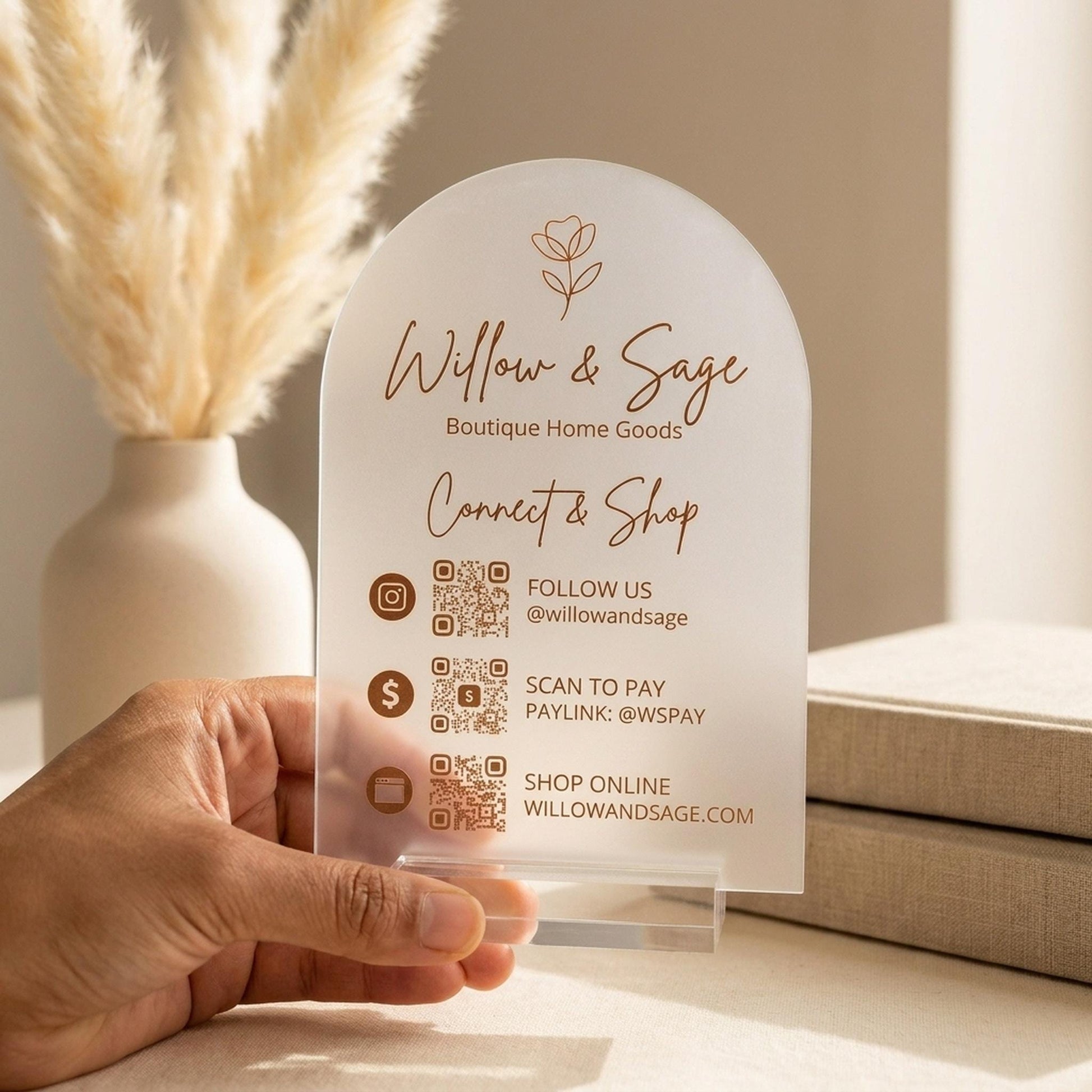Hand holding a custom QR code acrylic business sign