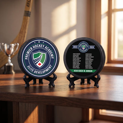 Hand holding a personalized hockey team puck with crest logo against sparkly background