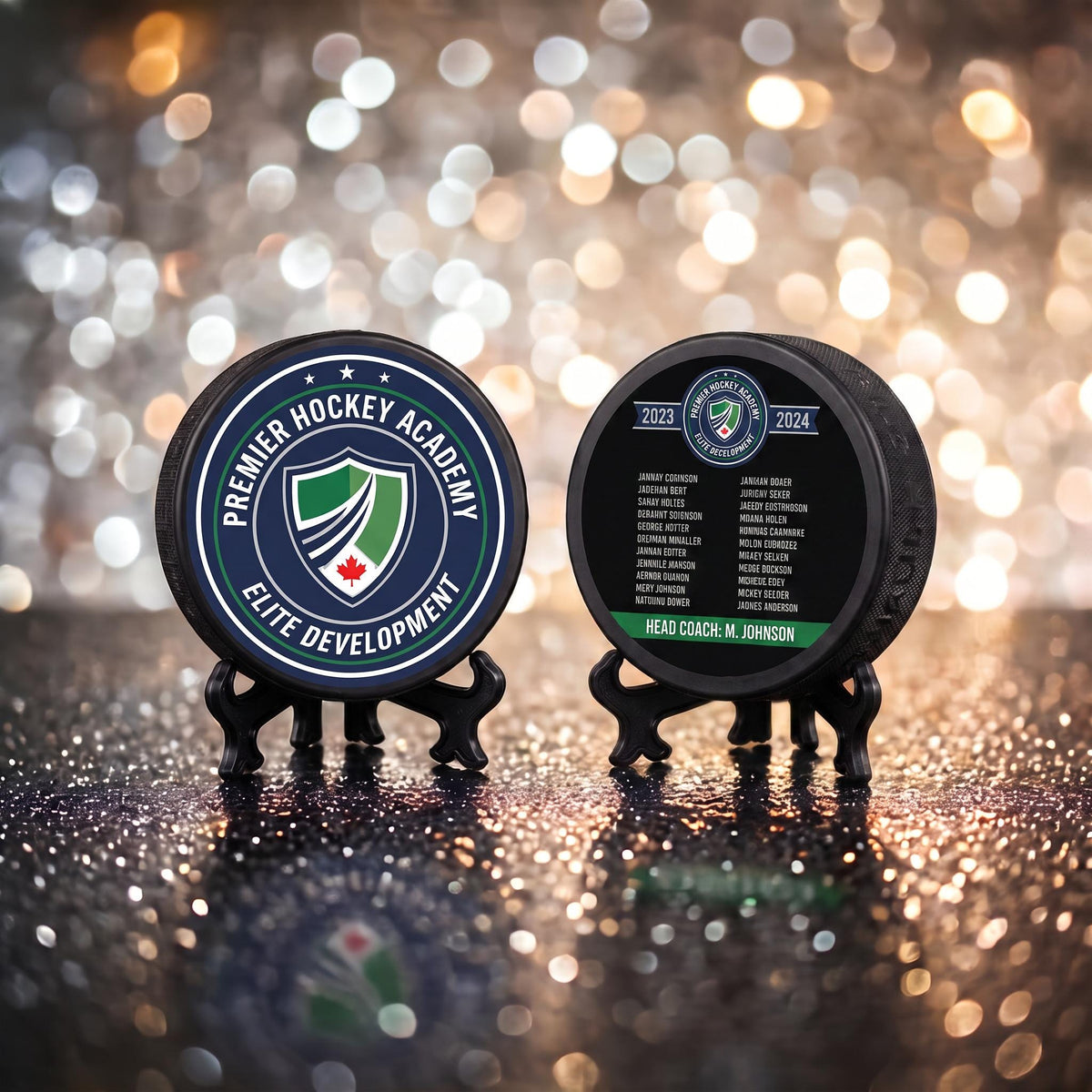Front and back of custom hockey puck showing crest logo on front and engraved player roster with coach name on back