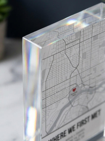 Close-up of acrylic map block beveled edge showing engraved street map detail and light refraction