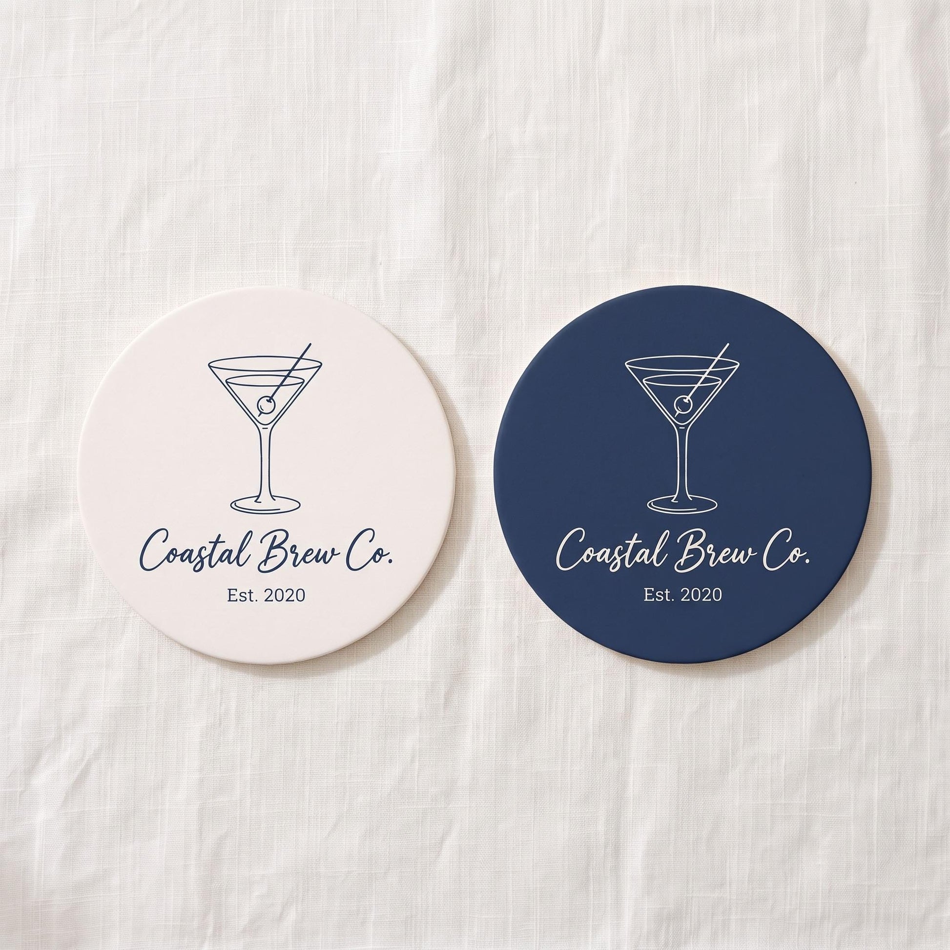 Two color options for the custom coaster: cream matte with navy print and navy blue with cream print.