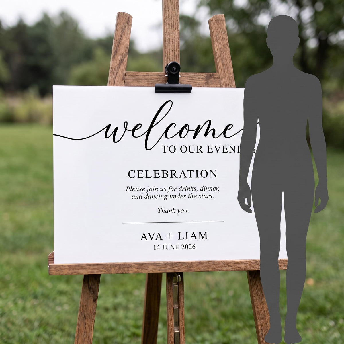 Custom acrylic welcome sign on its easel next to a person's silhouette to show its full display height.