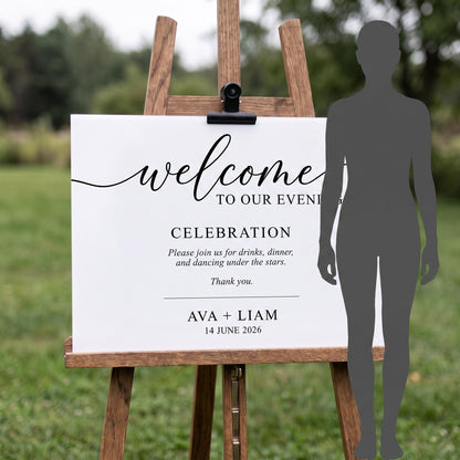 Custom acrylic welcome sign on its easel next to a person's silhouette to show its full display height.
