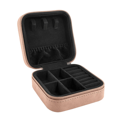 Open Creekside blush leatherette travel jewelry box showing felt-lined compartments and ring slots inside